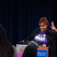 Girls of Color Summit previous event and a women behind a podium speaking